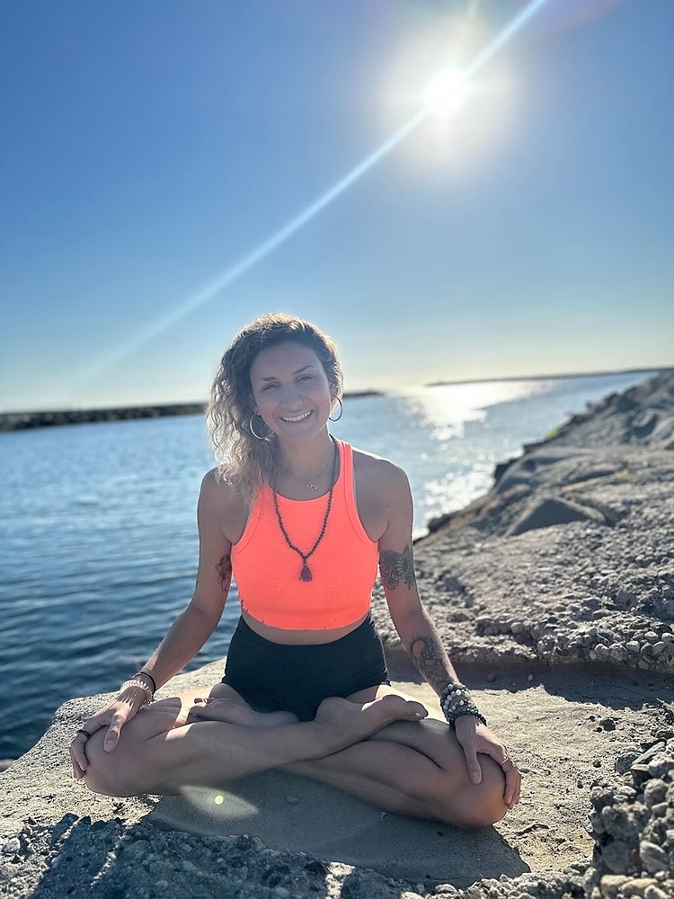 Yoga teacher Kyla Porcellini at the beach