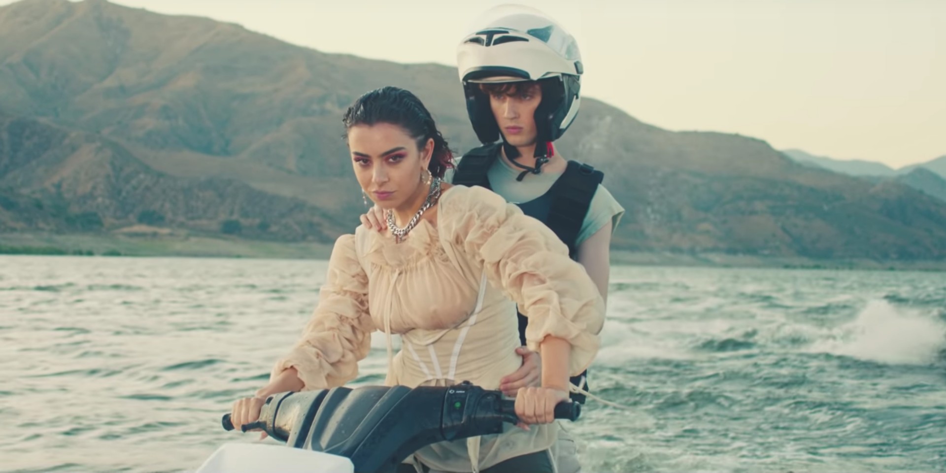 Charli XCX and Troye Sivan meet in the distant future on jet skis in '2099'