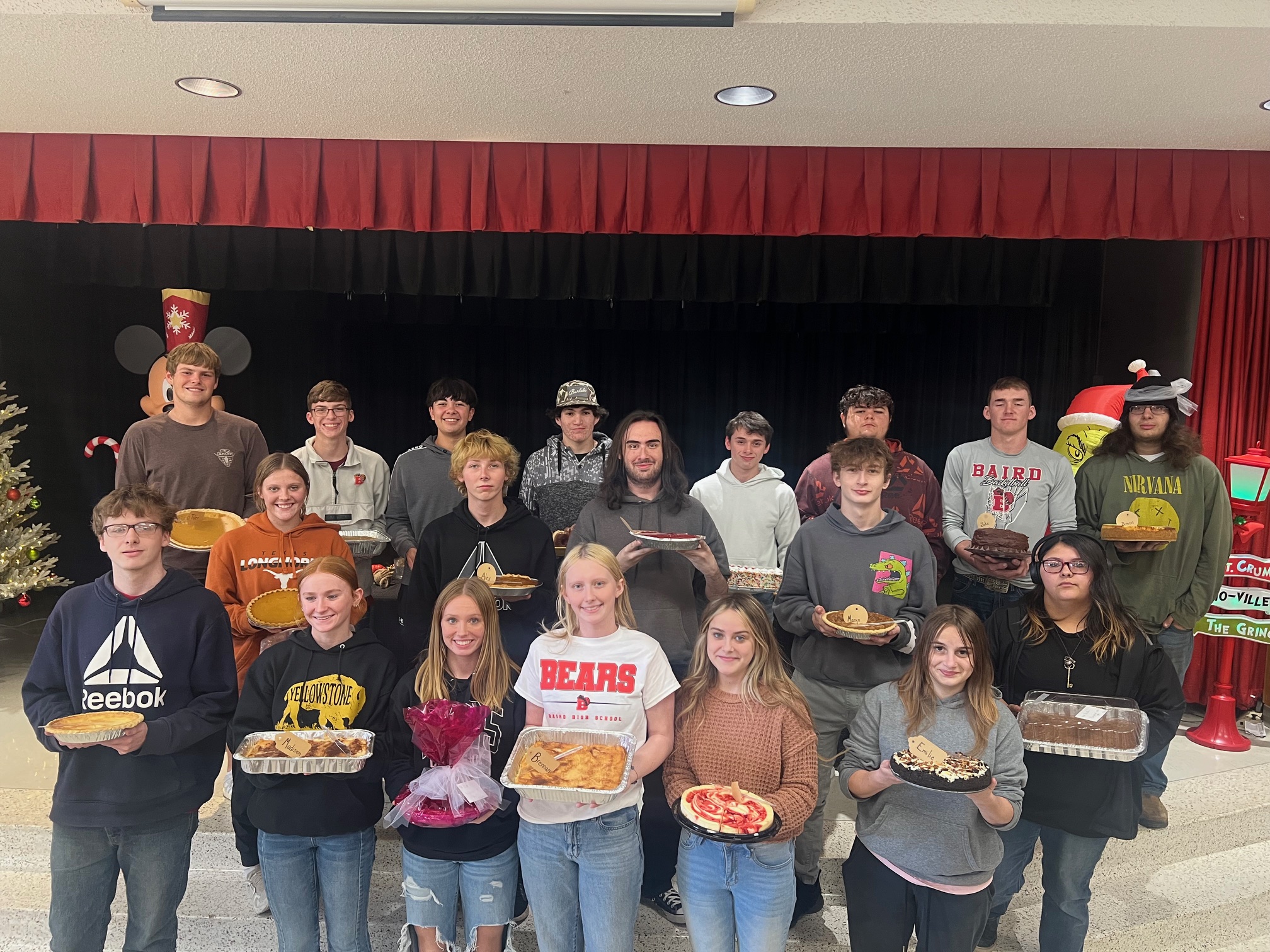 Senior class holding their pies