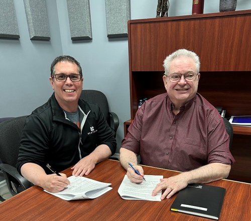 BESTECH President Patrick Fantin, and W.G. Spencer owner Willis Spencer signing the official contract. 