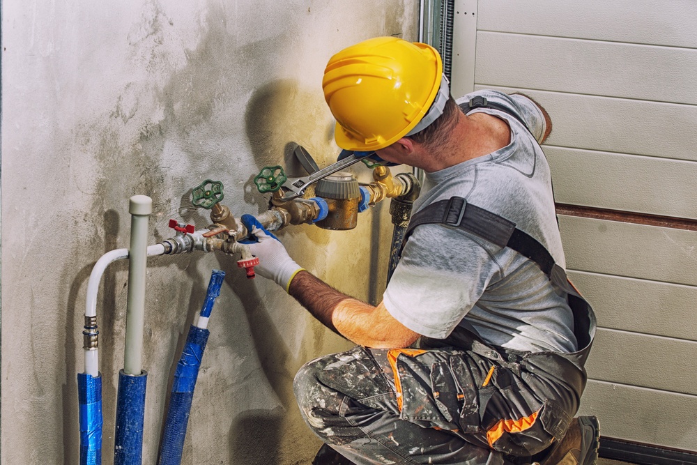 plumber working on new home