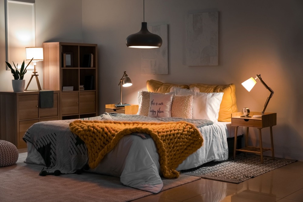 bedroom space lit by table lamps