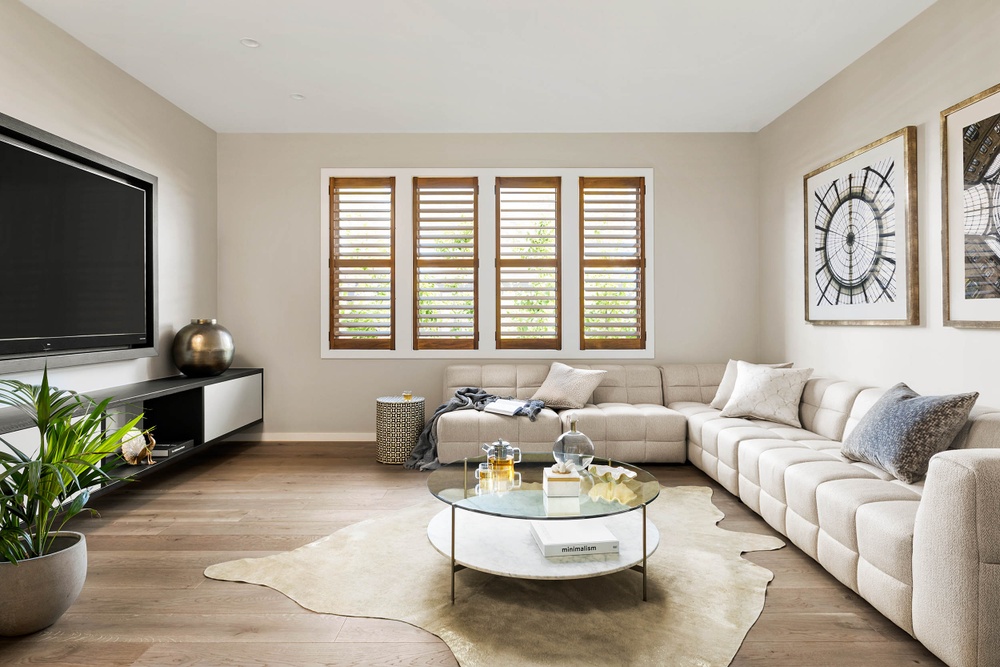 living room with timber flooring by Henley Homes