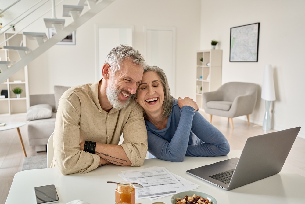 happy couple looking at investing in property