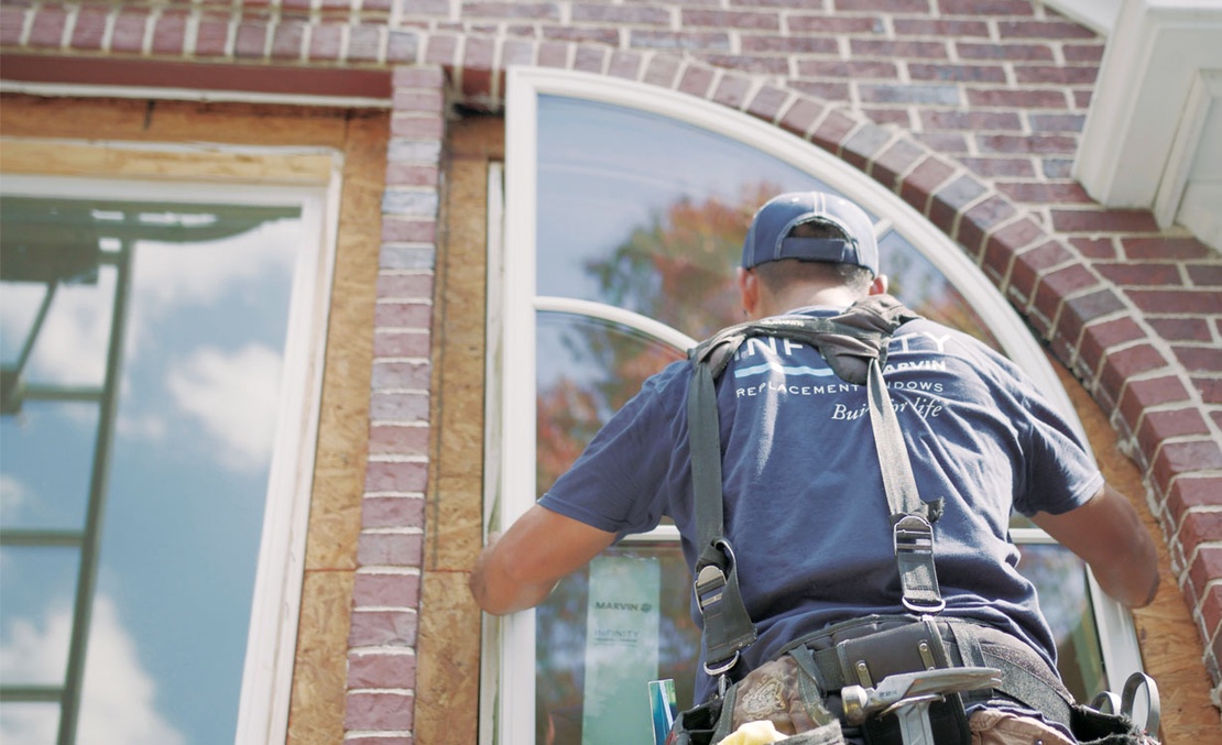 Man replacing window