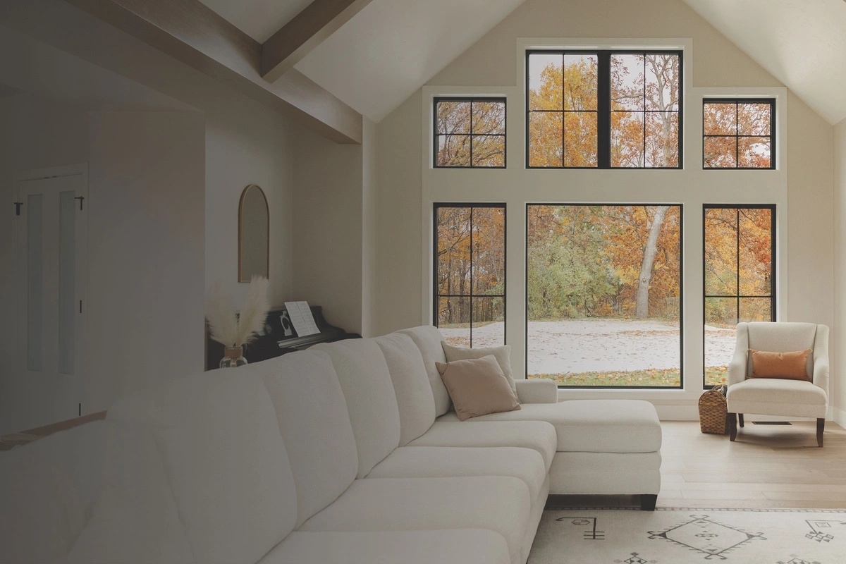 Living room with white Infinity from Marvin replacement windows and door