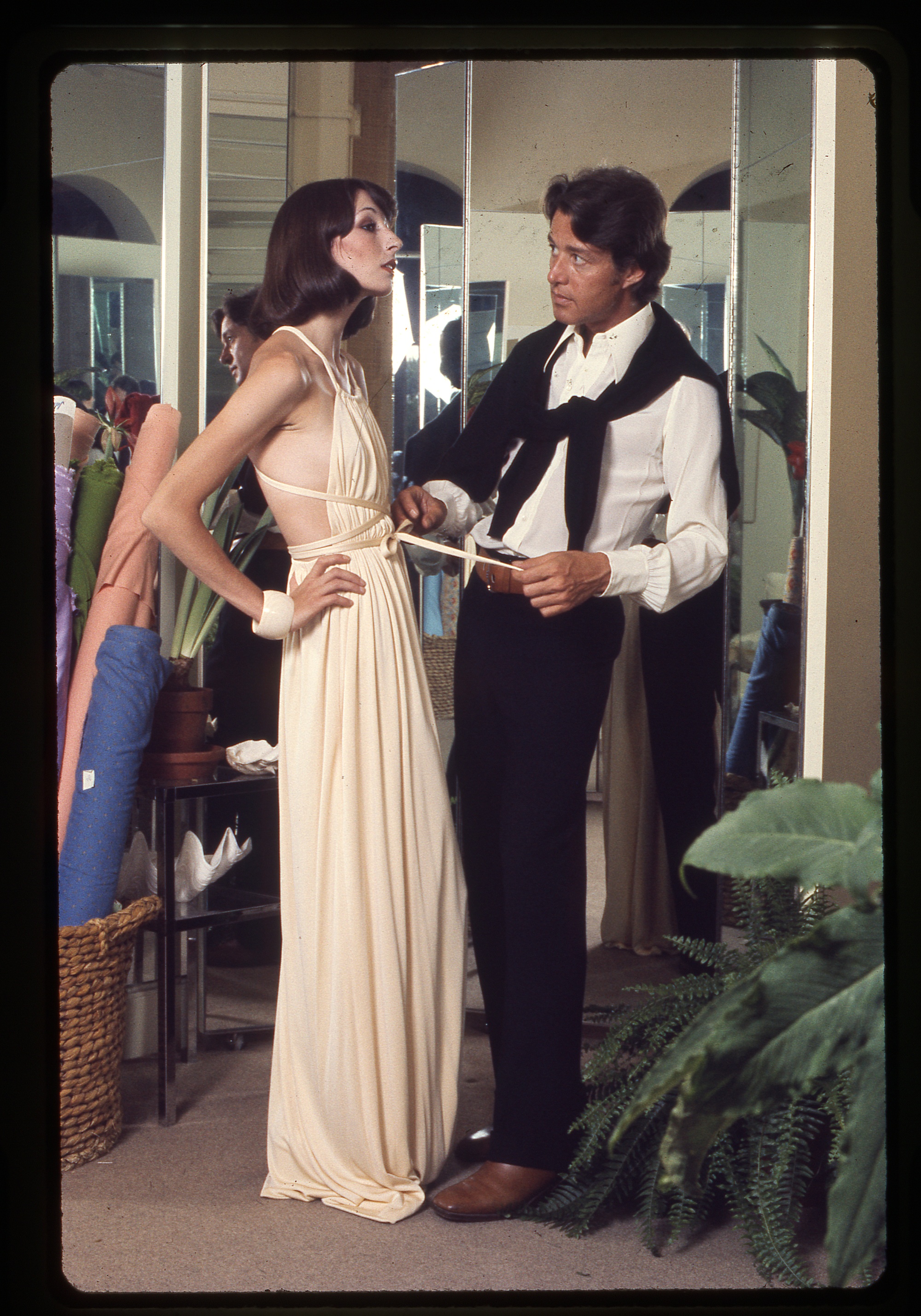 Halston doing a fitting with a model at his original Manhattan atelier ©Berry Berenson Perkins_Halston and Angelica Huston.jpg