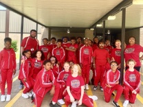 Group of students wearing red Step Team uniforms