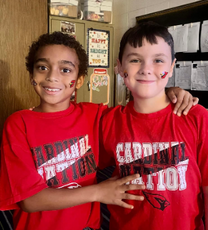 Two boys with Cardinal tattoos