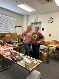 Director of Ed Services Amy Espinoza and Administrative Secretary Amber Fabela working to sort and divide the donated school supplies.