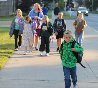 Students arrive on the first day of school