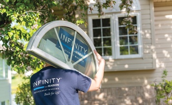 Man carrying Round Top window