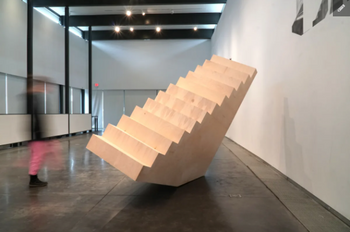 A sculpture in the form of a set of stairs rotated sideways, to the right.