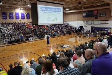 staff fill the gym at Oak Harbor High School for the OHPS kickoff