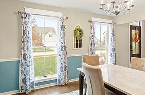 Interion dining room with white double hung windows