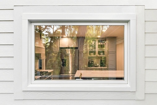 View of a white awning window from a home's exterior