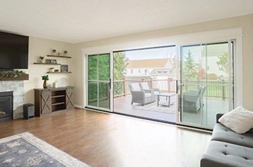 Living room with sliding patio door opening to outdoor deck