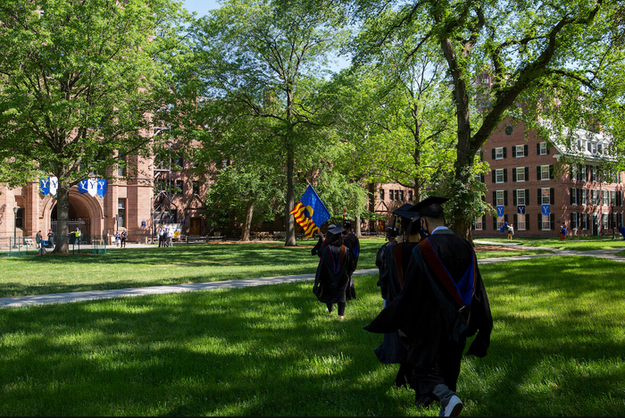 Documentation of the 2021 Yale School of Art commencement, with the banner carried each year by a graduating student.