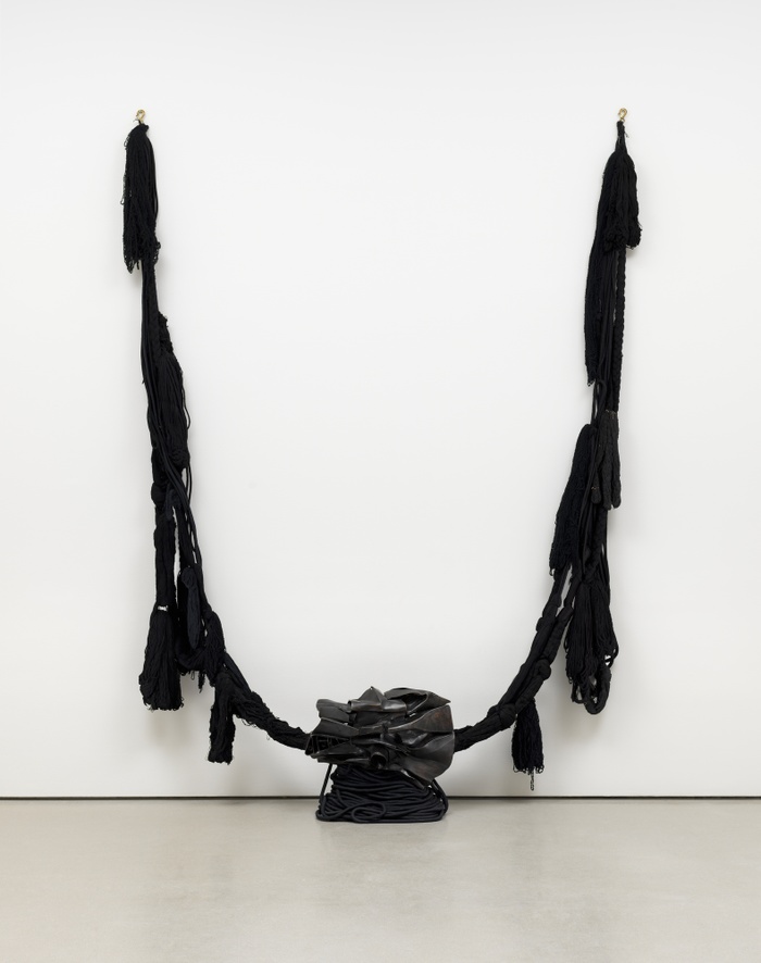 Installation image of Barbara Chase-Riboud's "The Albino," 1972. Bronze with black patina, wool and other fibers.