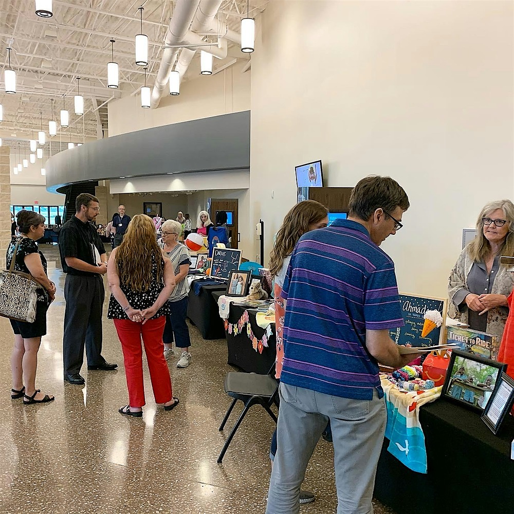 Parents visiting children's tables