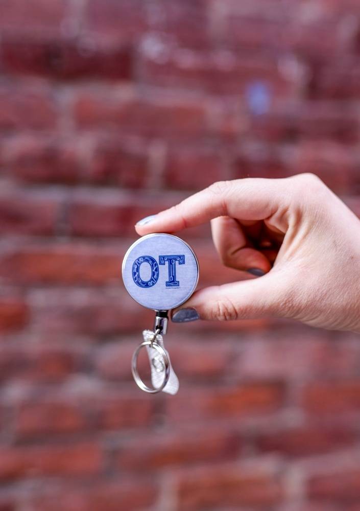 OT w/ AE Badge Reel