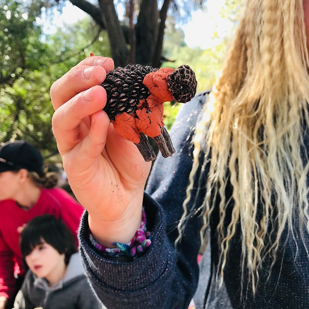 Kid holding up a Clay Animal