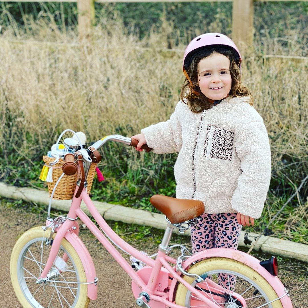 girl with pink Bobbin pink with handlebar tassels