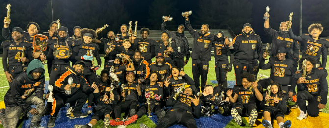 Buford Super Bowl champions in uniforms with trophies