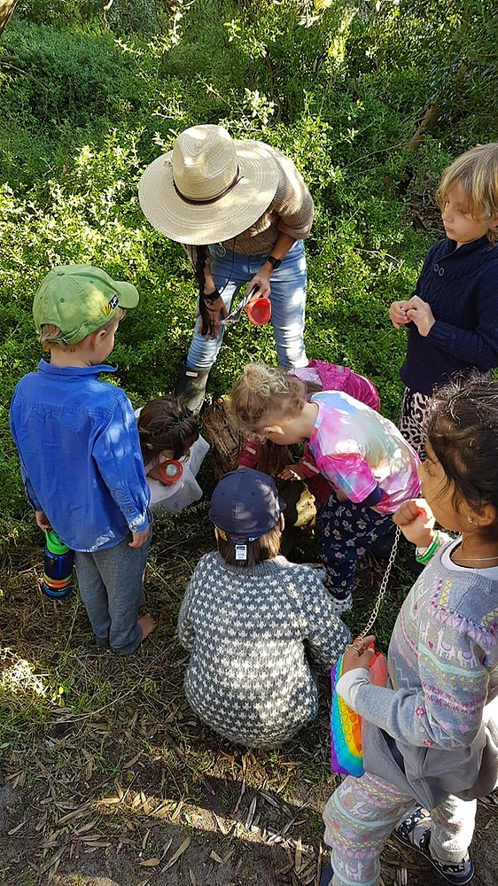 Kids looking around on the ground