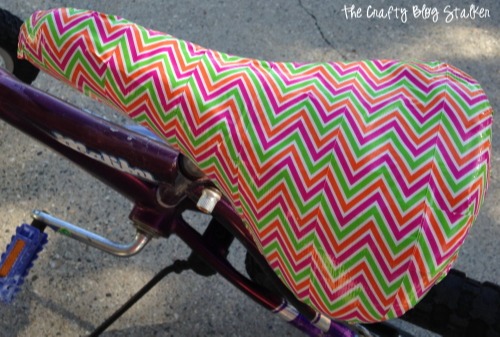 bike seat decorated with zig-zag colourful tape