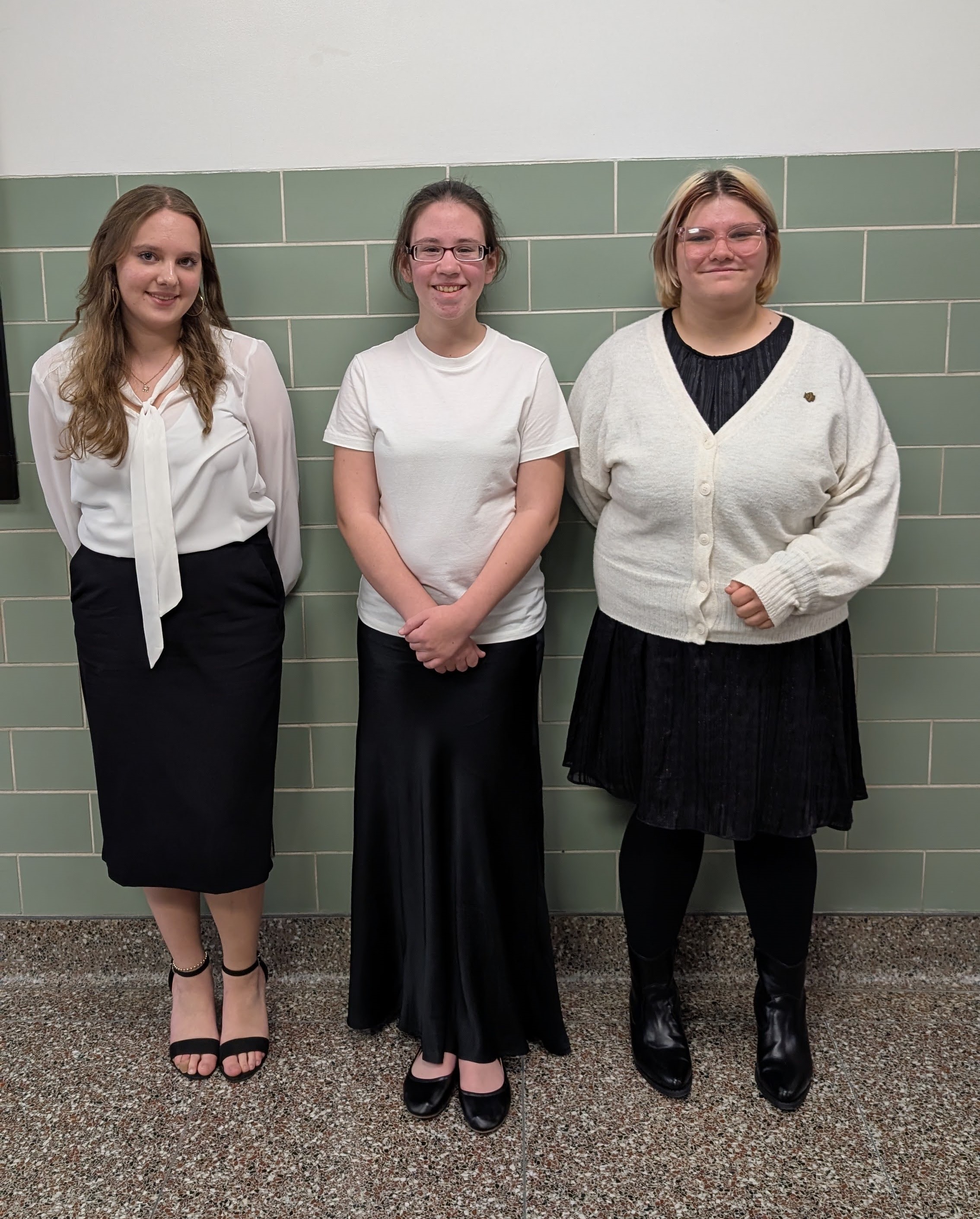 Three Students stand in the hallway at Junior High Area All-State Music Festival