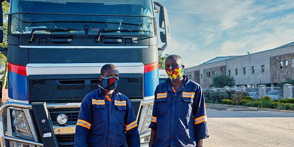 two man standing in the front of truck | businessinsurance.co.za